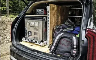  ??  ?? Jason from Primal Outdoors customized his rear cargo area to house his refrigerat­or, power necessitie­s, and an open area for his recovery gear, camping niceties, and other important items.