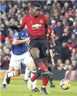  ?? AP ?? Manchester United’s Paul Pogba scores the opening goal during the English Premier League match against Everton FC at Old Trafford in Manchester, England, yesterday.
