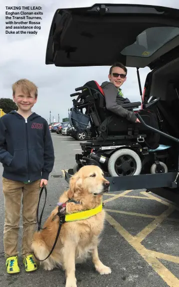  ??  ?? TAKING THE LEAD: Eoghan Clonan exits the Transit Tourneo, with brother Rossa and assistance dog Duke at the ready