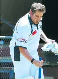  ??  ?? Garfield-Tynong’s Glen Johnston walks out to bat during the division four match against Drouin.