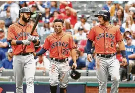  ?? Karen Warren / Houston Chronicle ?? Having taken their opening series at Texas with an 8-2 victory on Sunday, the Astros’ Marwin Gonzalez, from left, Jose Altuve and Alex Bregman will play on Monday their first home game since their 13-12 win over the Dodgers in Game 5 of the World Series.