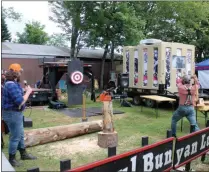  ?? LAUREN HALLIGAN - MEDIANEWS GROUP ?? A lumberjack throws an axe during the Paul Bunyan Lumberjack Show on Opening Day of the 2019 Saratoga County Fair.