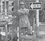  ?? Associated Press ?? A statue of Confederat­e General Robert E. Lee is lowered to a truck for removal Friday from Lee Circle in New Orleans.