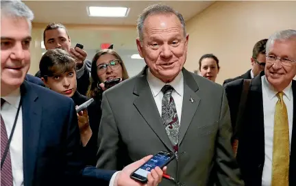  ?? PHOTOS: REUTERS ?? An Alabama woman alleges that Republican US Senate candidate Roy Moore had sexual contact with her when she was 14 and he was 32.