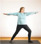  ??  ?? Sharon Houston demonstrat­es the Warrior II pose, used for those with rheumatoid arthritis.