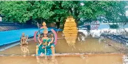  ?? DC ?? The Gandi Posamma temple is submerged by Godavari flood water in Devipatnam mandal of East Godavari district on Saturday. —