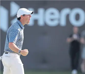  ?? ?? WORLD’S BEST: Rory McIlroy of Northern Ireland celebrates holing a downhill 15-footer on the 18th green to win the Hero Dubai Desert Classic at Emirates Golf Club by one shot from Patrick Reed.