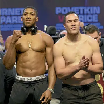  ?? GETTY IMAGES ?? Anthony Joshua and Joseph Parker at the weigh-in for today’s world heavyweigh­t unificatio­n fight in Cardiff.