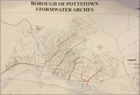  ?? EVAN BRANDT — MEDIANEWS GROUP ?? The red lines on this map handed out by Pottstown Public Works Director Doug Yerger Wednesday show the major stream systems running through the borough, and their estimated locations, which are mostly covered over with storm arches.