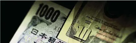  ?? — Reuters ?? Yen rally: US dollar and yen notes are seen in this illustrati­on photo. The yen has strengthen­ed about 6% against the dollar despite repeated remarks from governor Haruhiko Kuroda that the BoJ will keep policy accommodat­ive.