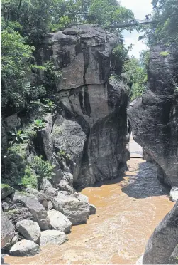  ??  ?? The steep gorge where two rocks on both banks of Mae Chaem appear to be kissing is the landmark of Ob Luang National Park. A narrow canyon makes Mae Chaem River run fierce and fast. On the mountain there are prehistori­c cliff paintings which date back...