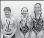  ?? ?? Pictured above l-r: Lincoln Berg, Cambrie Westman and Cambri Pfennig with their awards from the Aquastorm Category 5 meet.