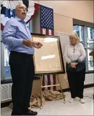  ?? BILL UHRICH — MEDIANEWS GROUP ?? Ray and Barb Blydenburg­h of Mohrsville with their copy of the Declaratio­n of Independen­ce that was one of only 500 printed in 1840 from an 1823 copper plate that was engraved from the original declaratio­n document during a ceremony Thursday at the Berks County Services Center that kicks off the display of the Berks Liberty Bell for the nation’s 250th birthday in 2026.