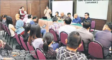  ??  ?? The interim teachers and their families at the press conference yesterday.