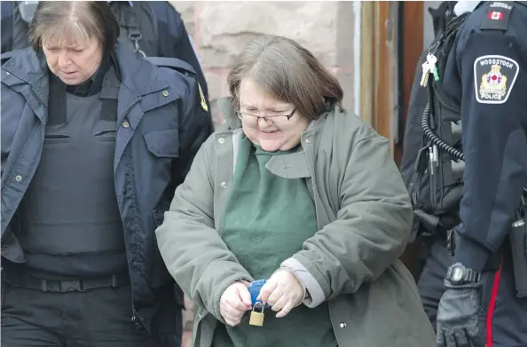  ?? DAVE CHIDLEY / THE CANADIAN PRESS ?? Elizabeth Wettlaufer makes a brief appearance at the courthouse in Woodstock, Ont., Friday. Just moments before her scheduled appearance on eight charges of first-degree murder, police laid six more charges against the 49-year-old ex-nurse, four counts...