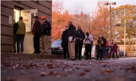  ?? Photograph: Alyssa Pointer/Reuters ?? Voters line up to cast their ballots at the start of early voting in Atlanta, Georgia, on 26 November.