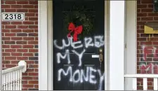  ?? TIMOTHY D. EASLEY — THE ASSOCIATED PRESS ?? Graffiti reading, “Where’s my money” is seen on a door of the home of Senate Majority Leader Mitch McConnell, R-Ky., in Louisville, Ky., on Saturday, Jan. 2, 2021.