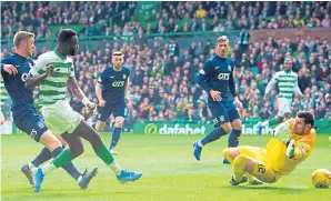  ??  ?? Odsonne Edouard slots home Celtic’s second against Kilmarnock.