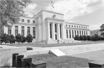  ?? — AFP photo ?? File photo shows the US Federal Reserve building is seen in Washington, DC. For the second time this year, the US central bank appears poised to raise interest rates despite fresh signs the world’s largest economy is not in peak condition.