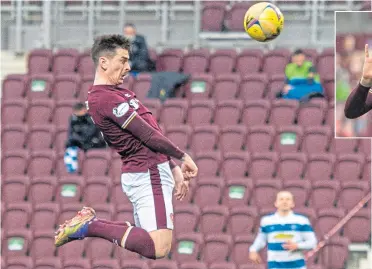  ??  ?? Hearts’ Jamie Walker rises to head home, making it 1-1 against Morton at Tynecastle