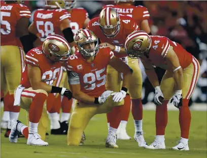  ?? PHOTOS BY NHAT V. MEYER — BAY AREA NEWS GROUP, FILE ?? San Francisco 49ers starting quarterbac­k Nick Mullens (4) checks on George Kittle (85) during their 2018 game against the Raiders at Levi’s Stadium in Santa Clara.