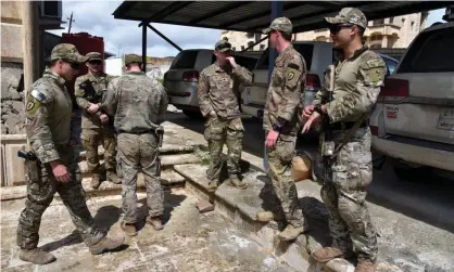 ?? Photograph: Ammar Salih/EPA ?? US troops in Iraq. Three separate militia attacks in the span of a week have struck Camp Taji and Basmaya bases.