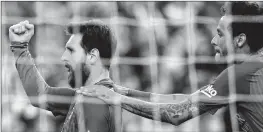  ?? AFP ?? FC Barcelona's Lionel Messi, left, celebrates after scoring with his teammate Neymar during the Spanish La Liga soccer match in Barcelona, Spain on Saturday