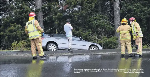  ??  ?? Emergency services attend a call to Stone St, in Dunedin, about 3.20pm yesterday after a car went off the road. A police spokeswoma­n said there were no details about any injuries. PHOTO: GREGOR RICHARDSON