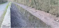  ?? ?? The drained canal between Brecon Basin and Brynich Lock.