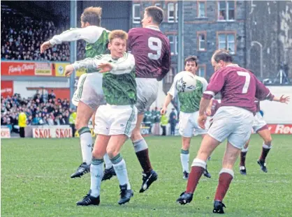  ?? ?? Eamonn Bannon (No.7) puts the Hibs defence under pressure in an Edinburgh derby in March, 1992. Hearts won 2-1