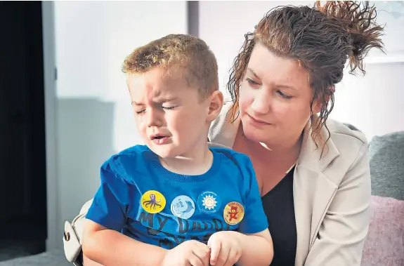  ??  ?? Jaxson Mcavoy with mum Katie following the freak accident at the entrance to Deep Sea World in North Queensferr­y.