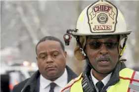  ?? Pittsburgh Post-Gazette ?? Pittsburgh Fire Chief Darryl Jones with Mayor Ed Gainey at the scene of the Fern Hollow Bridge collapse in January 2022.