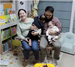  ??  ?? South Korean woman Seo Hyo-sun (left) speaks during an interview at her home in Buchon, South Korea. Parents whose babies are born in December often worry about their kids falling behind other children born earlier in the same year. — IC