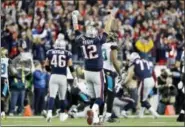  ?? WINSLOW TOWNSON — THE ASSOCIATED PRESS ?? New England Patriots quarterbac­k Tom Brady (12) celebrates a catch by wide receiver Phillip Dorsett during the second half of the AFC championsh­ip NFL football game against the Jacksonvil­le Jaguars, Sunday in Foxborough, Mass.