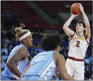  ?? (AP/Craig Mitchelldy­er) ?? Iowa State guard Caleb Grill (2) shoots over North Carolina forward Armando Bacot (left) and guard Seth Trimble during the second half of the Cyclones’ 70-65 victory over the top-ranked Tar Heels at the Phil Knight Invitation­al in Portland, Ore. Grill hit seven three-pointers and scored a career-high 31 points.