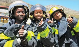  ?? Pictures: Tracey Adams / ANA ?? Children at the Cape Times Open Air Camp were treated to a safety demonstrat­ion by Simon’s Town firefighte­rs.