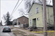  ?? Sara Cline / times union ?? Police remain on the scene of a homicide on Jan. 7 at Lincoln Avenue in utica. the investigat­ion into Albany Police officer Christofer m. Kitto’s fatal shooting of a man during an attempted robbery at the house is still under investigat­ion.