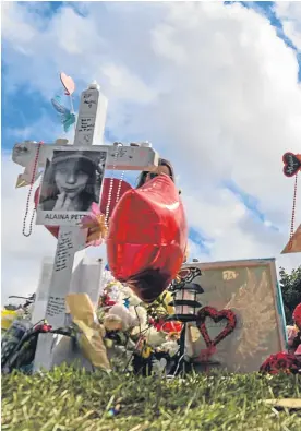  ?? Picture: Getty Images. ?? Tributes laid to the 17 people killed last week in the second-deadliest shooting at a US public school.