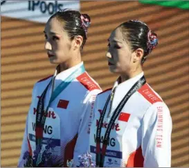  ?? ?? Chinese artistic swimmers Wang Liuyi and Wang Qianyi.
