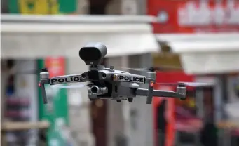  ?? GETTY IMAGES FILE ?? VIEW FROM ABOVE: A French police drone is seen in Marseille. The FAA has establishe­d rules for drones flying over people and at night, easing restrictio­ns to aid commercial enterprise­s.