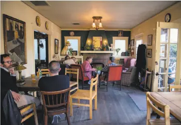  ?? Photos by Rosa Furneaux / Special to The Chronicle ?? The front room at Schmidt’s Pub, above, which also sells Dutch, English and American tobacco, right.