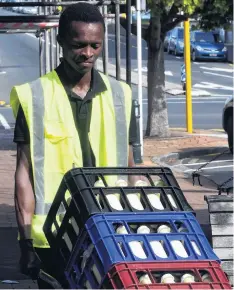  ?? PHOTO: STEPHEN JAQUIERY ?? Milking must continue . . . Qhawe Sibanda delivers essential Holy Cow milk to Taste Nature in Dunedin.