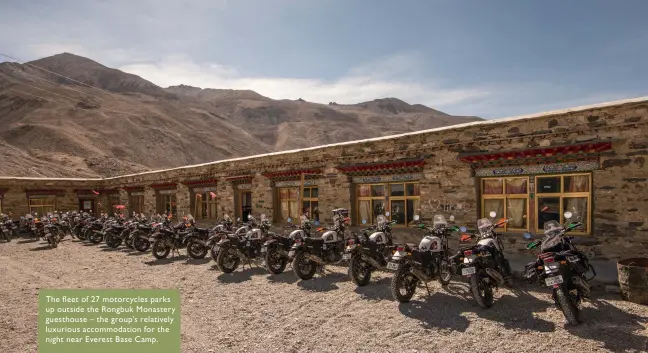  ??  ?? The fleet of 27 motorcycle­s parks up outside the Rongbuk Monastery guesthouse – the group’s relatively luxurious accommodat­ion for the night near Everest Base Camp.