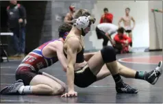  ?? Contribute­d photo by Shelly Culver ?? Rockmart’s Peyton Morris gets himself untangled during a match at the Class AA “B” Sectionals at Rockmart High School.