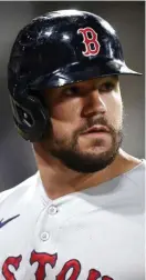  ?? Tns File; RiGHt, matt stone / HeRald staFF File; BeloW, Getty imaGes ?? ‘FRUSTRATED’: Red Sox first baseman Kyle Schwarber’s error on Monday night in Seattle cost them the game. Despite having minimal experience at first base, Schwarber was acquired at the deadline by Chaim Bloom, right, forcing manager Alex Cora, below, to play him at an unnatural position.