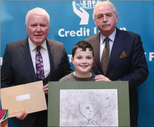  ??  ?? William Nolan, representi­ng Baltinglas­s Credit Union, with Marty Whelan and Gerry Thompson from the Irish League of Credit Unions.