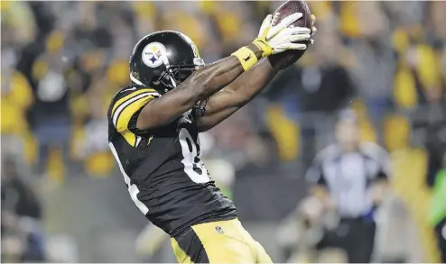  ?? DON WRIGHT / THE ASSOCIATED PRESS ?? Receiver Antonio Brown was fined for twerking after a touchdown, even though the league had issued celebrator­y tweets that included a pixelated, animated version of Brown dancing after his score, as well as congratula­tory words.