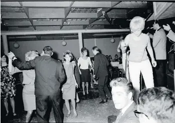  ?? GEORGE DIACK/FILES ?? A go-go girl, right, and patrons dance at the Pink Pussycat Cabaret in Vancouver on Sept. 26, 1966. The Pink Pussycat was one of many nightclubs in the ‘60s that operated as a “bottle club.”