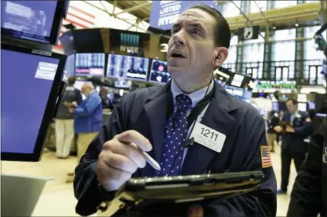  ?? RICHARD DREW — THE ASSOCIATED PRESS ?? Trader Tommy Kalikas works on the floor of the New York Stock Exchange, Monday. U.S.