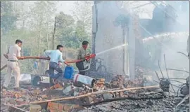  ?? AP PHOTOS ?? Rescuers douse the fire after an explosion at a firecracke­r factory in Balaghat, Madhya Pradesh, on Wednesday.